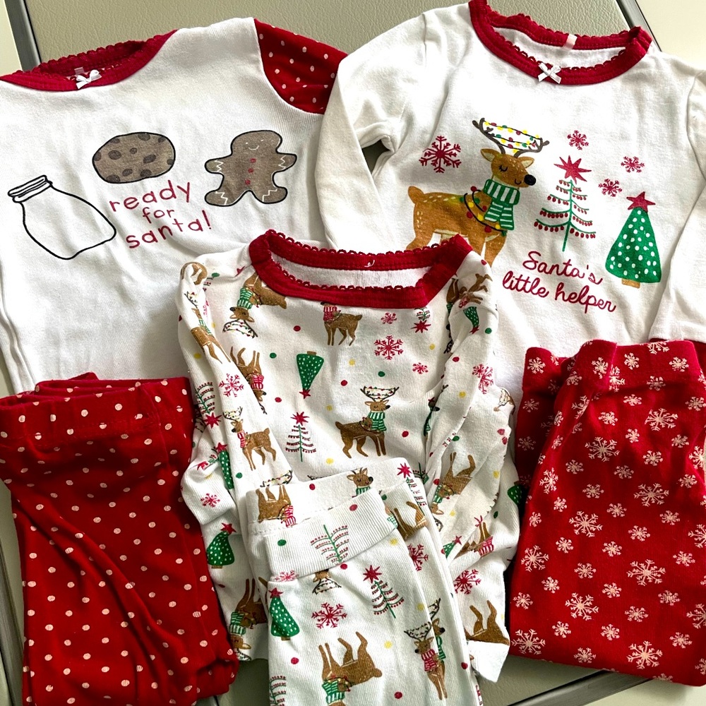 Three sets of holiday pajamas, size 18, gently worn.
